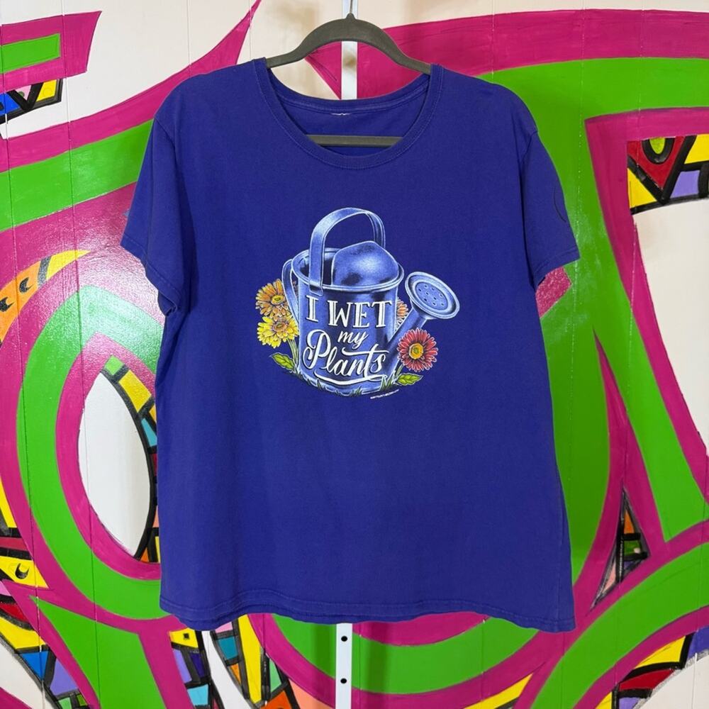 Vibrant Purple Short Sleeve Tee with Playful Graphic. Similar to a size 1X/2X